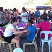 Doctors from Canada and Manila braving the summer heat to tend to approx 150 patients